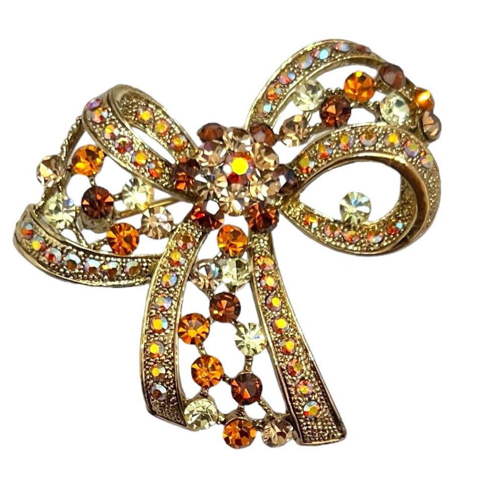 ORANGE, BROWN AND AURORA BOREALIS CRYSTAL BOW GOLD TONE BROOCH